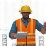 Person assessing a building site with plans or tools